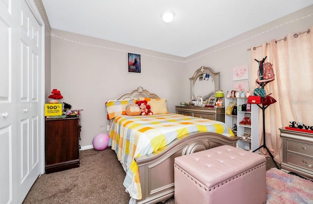 bedroom featuring carpet floors, a closet, and baseboards