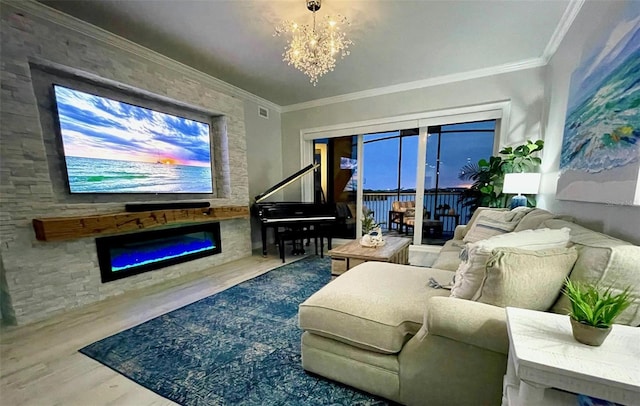 living room with crown molding, hardwood / wood-style floors, and an inviting chandelier