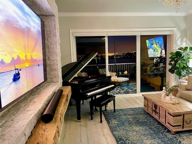 living area with crown molding and wood finished floors