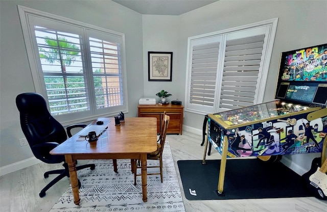 office featuring wood finished floors and baseboards