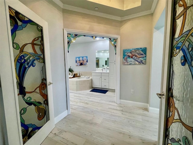 full bathroom with crown molding, baseboards, wood finished floors, and vanity