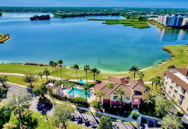 aerial view featuring a water view and golf course view