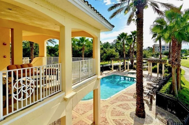 community pool featuring a patio area and a pergola