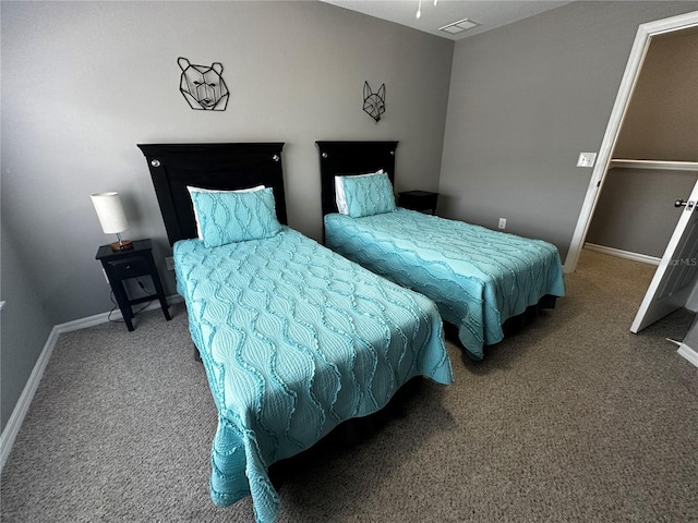 bedroom with carpet, visible vents, and baseboards