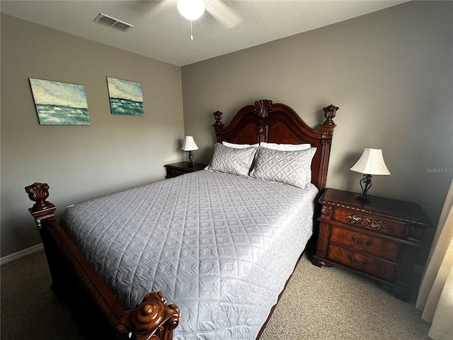 bedroom featuring light carpet, visible vents, and a ceiling fan