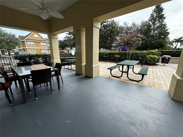 view of patio with outdoor dining space and ceiling fan