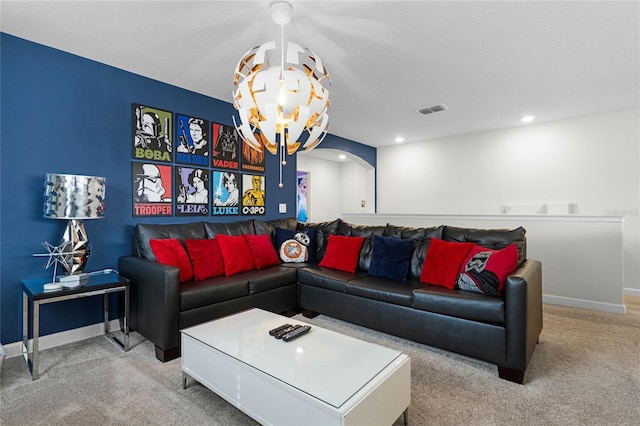 living room with arched walkways, recessed lighting, light colored carpet, visible vents, and baseboards