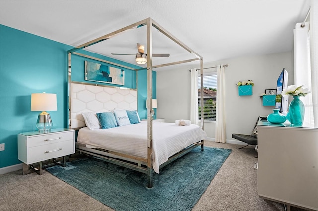 bedroom featuring ceiling fan, carpet floors, and baseboards