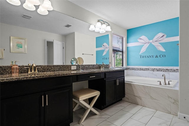 bathroom featuring a chandelier, visible vents, a sink, and double vanity