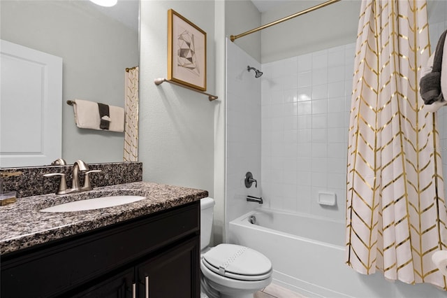 bathroom featuring toilet, shower / bath combination with curtain, and vanity