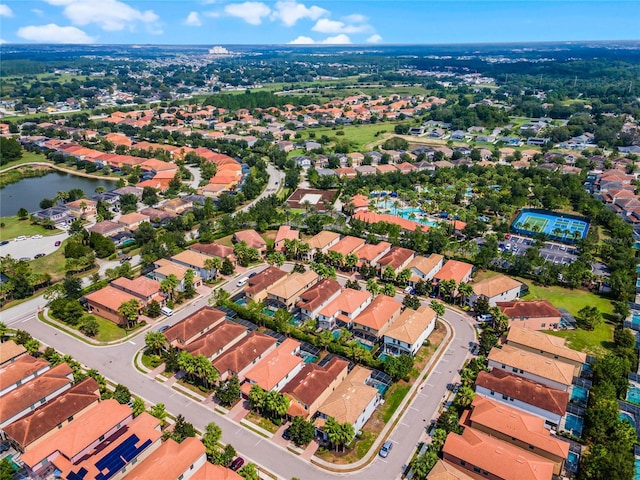 birds eye view of property featuring a water view and a residential view