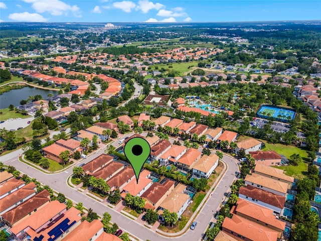 bird's eye view with a water view and a residential view