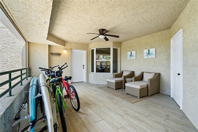 exterior space with a ceiling fan