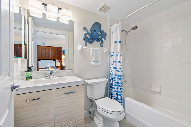 bathroom featuring toilet, vanity, visible vents, tasteful backsplash, and shower / bath combination with curtain