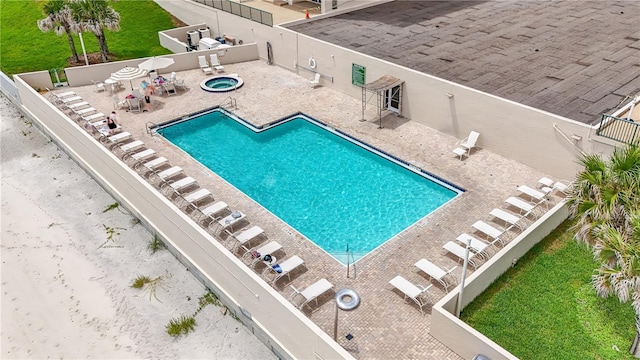 pool featuring a patio and fence