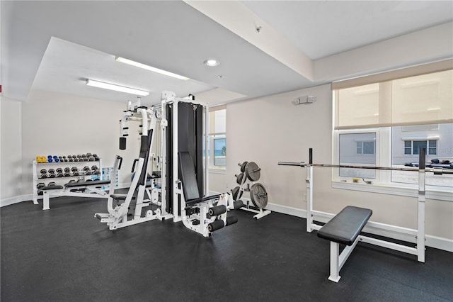 exercise room featuring baseboards