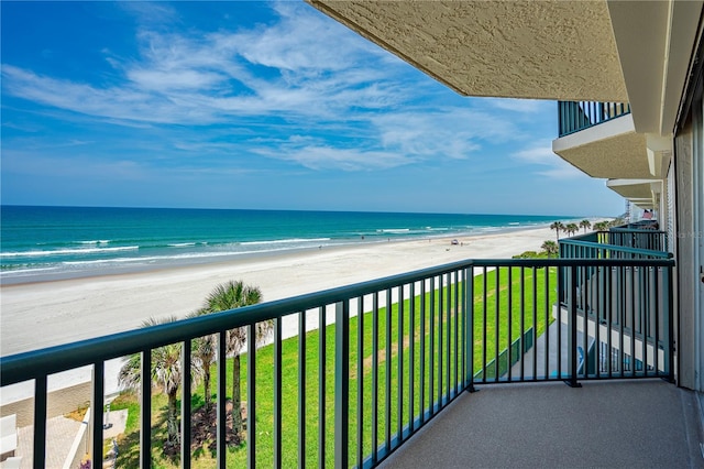 balcony with a view of the beach and a water view