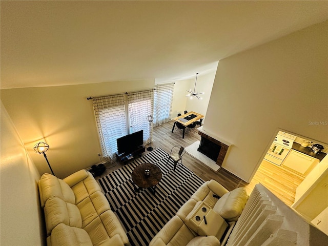 living room featuring ceiling fan and hardwood / wood-style floors