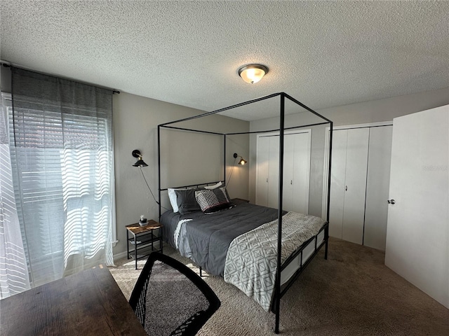 carpeted bedroom with a textured ceiling