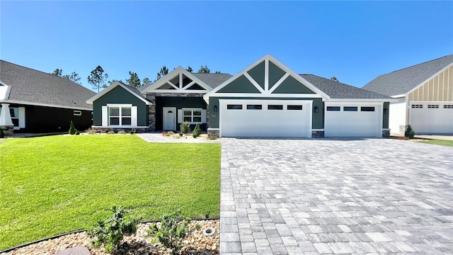 view of front of property with a garage and a front yard