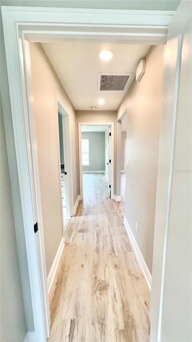 corridor featuring light hardwood / wood-style flooring