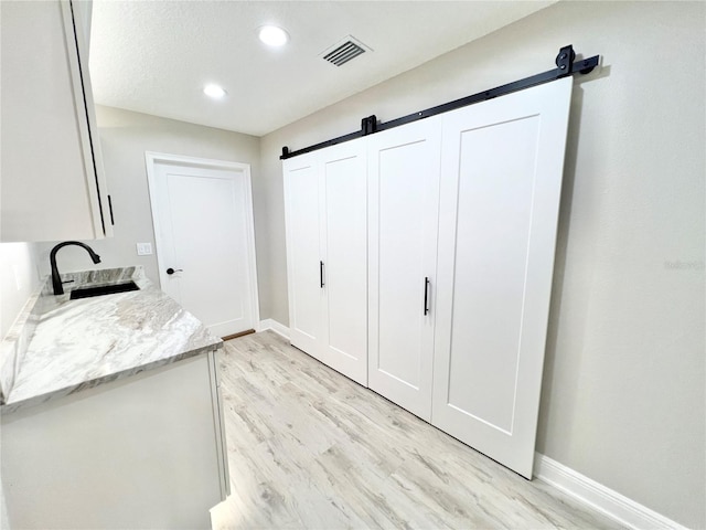 interior space featuring sink and hardwood / wood-style floors