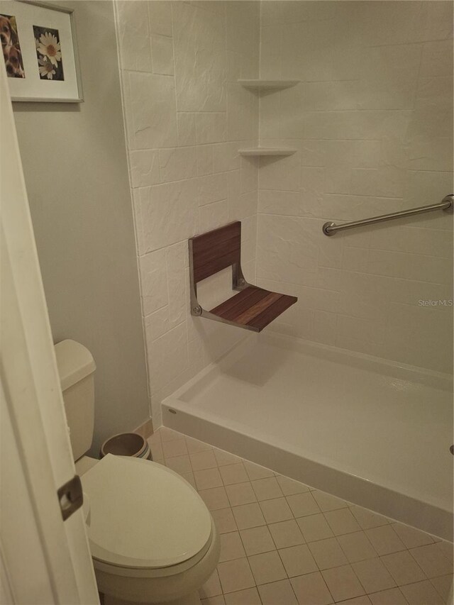2909 Clubview Unit 2909, Orlando, FL 32822 - full bathroom featuring toilet, a shower stall, and tile patterned flooring