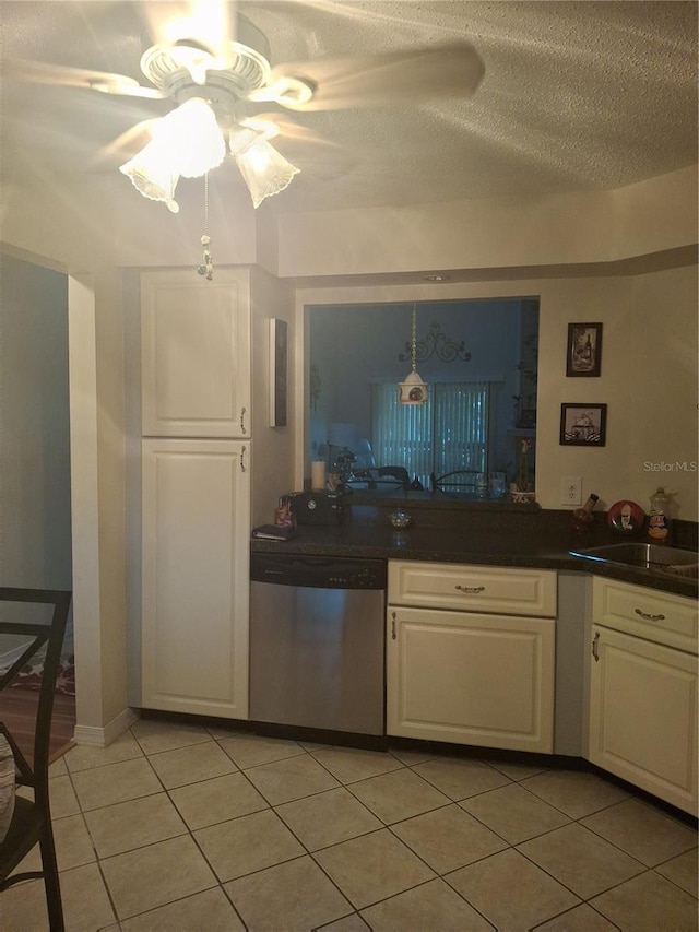 2909 Clubview Unit 2909, Orlando, FL 32822 - kitchen with dishwasher, a ceiling fan, light tile patterned flooring, white cabinets, and a textured ceiling