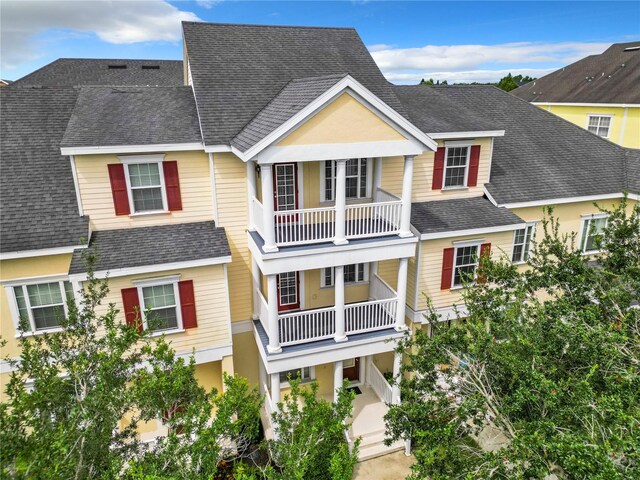 view of front of property with a balcony