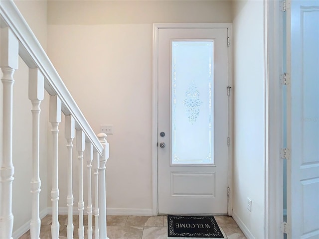 entryway featuring light tile patterned floors