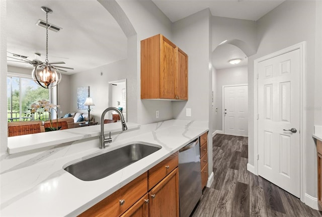 kitchen with dark hardwood / wood-style floors, dishwasher, light stone countertops, ceiling fan, and sink