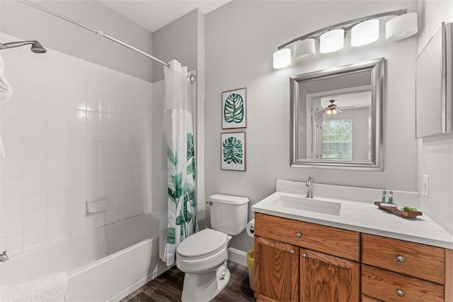 full bathroom featuring toilet, vanity, shower / tub combo with curtain, ceiling fan, and wood-type flooring