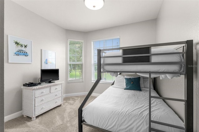 8105 Coconut Palm Way Unit 203, Kissimmee, FL 34747 - bedroom featuring baseboards and light colored carpet