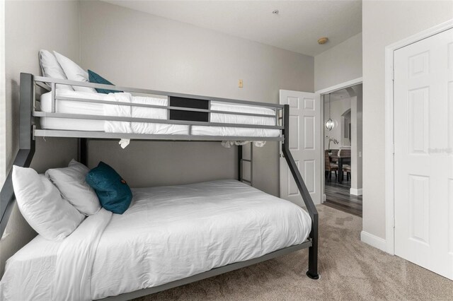 8105 Coconut Palm Way Unit 203, Kissimmee, FL 34747 - bedroom with carpet floors and arched walkways