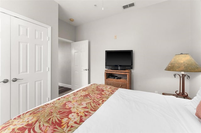 bedroom featuring hardwood / wood-style flooring and a closet