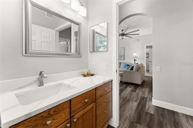 bathroom featuring ceiling fan, vanity, and hardwood / wood-style flooring