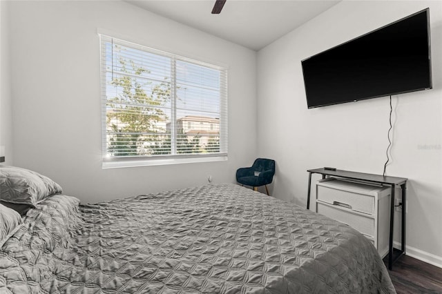 bedroom with ceiling fan and dark hardwood / wood-style floors