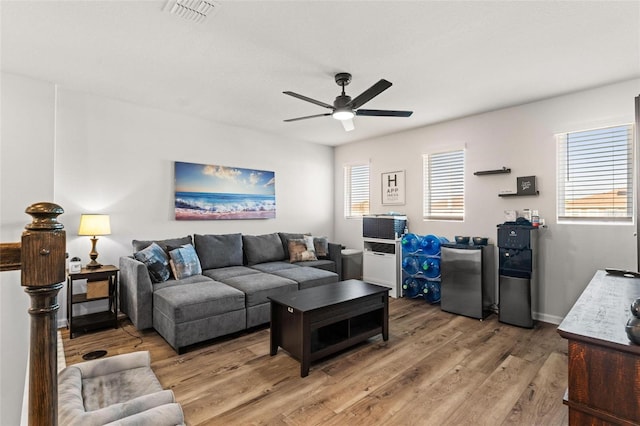 living room with ceiling fan and hardwood / wood-style floors