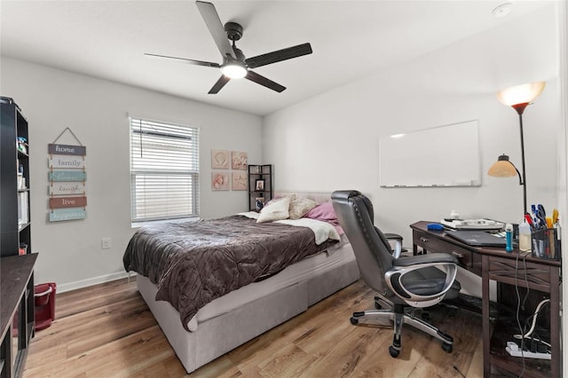 bedroom featuring ceiling fan and light wood-type flooring