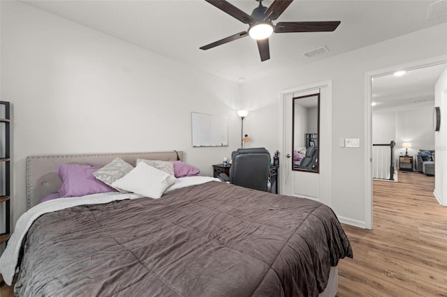 bedroom with ceiling fan and light hardwood / wood-style flooring