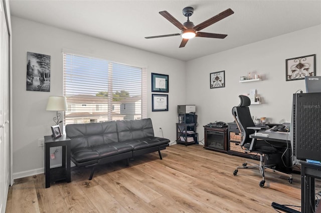 office space featuring ceiling fan and light wood-type flooring