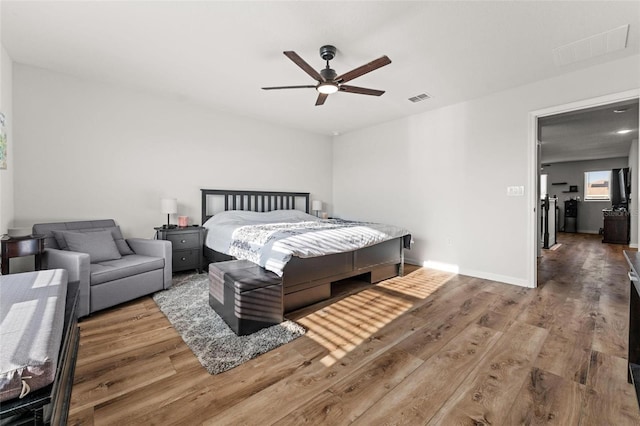 bedroom featuring ceiling fan and wood-type flooring