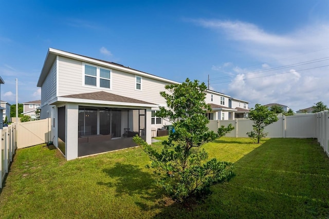 back of property featuring a patio area and a yard