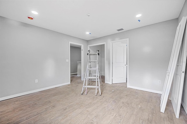 unfurnished bedroom featuring light wood-type flooring