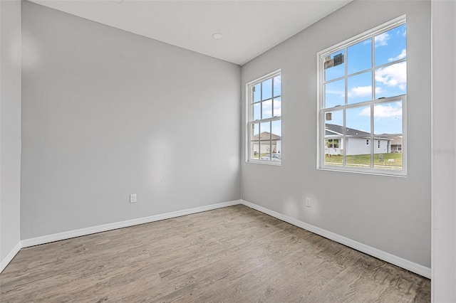 unfurnished room featuring light wood-type flooring