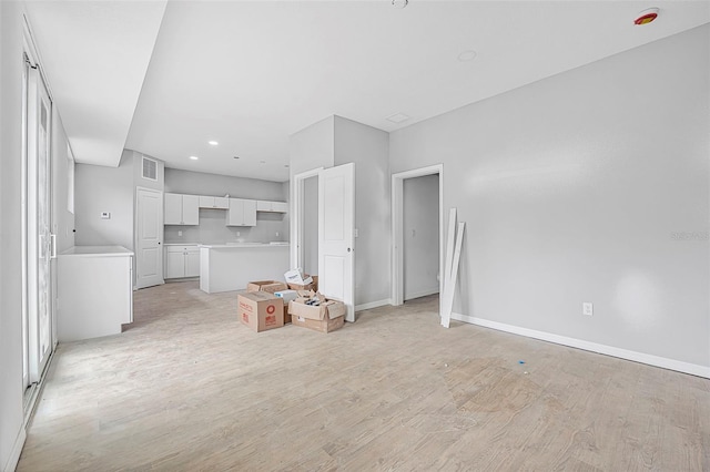 unfurnished living room featuring light hardwood / wood-style floors