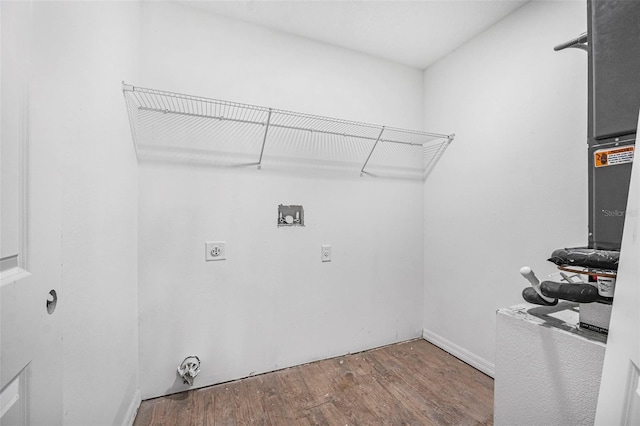 washroom featuring washer hookup, hardwood / wood-style floors, and electric dryer hookup