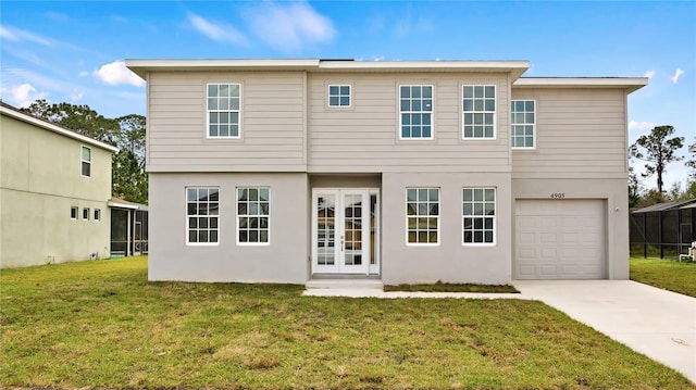 view of front facade featuring driveway, a front lawn, an attached garage, and stucco siding