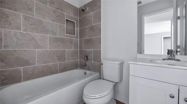 bathroom featuring visible vents, shower / washtub combination, vanity, and toilet