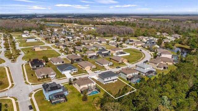 birds eye view of property with a residential view